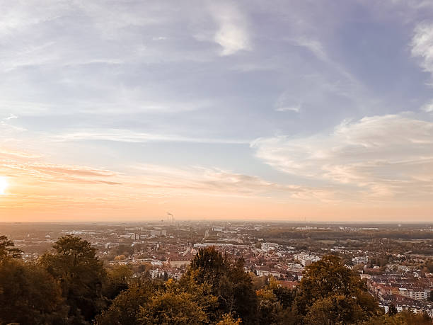 istock Beautiful sunset over a city with a few clouds in the sky 2208516292