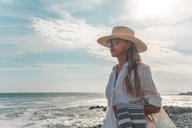 istock Tourist enjoying summer time by the sea 2208518214