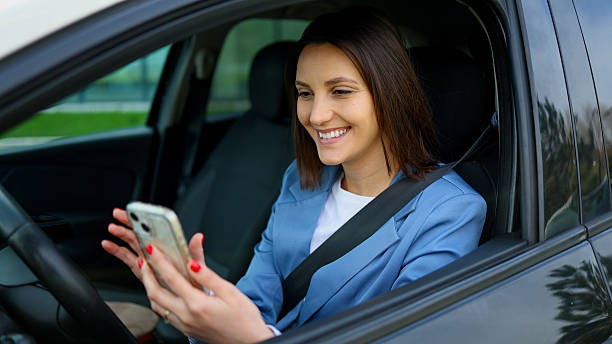 istock Businesswoman using smartphone while sitting in car 2208519779