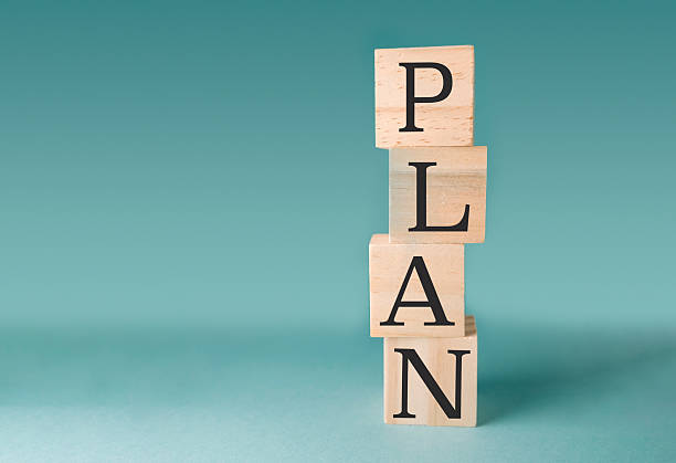 Stack of wooden blocks with the word Plan written on them