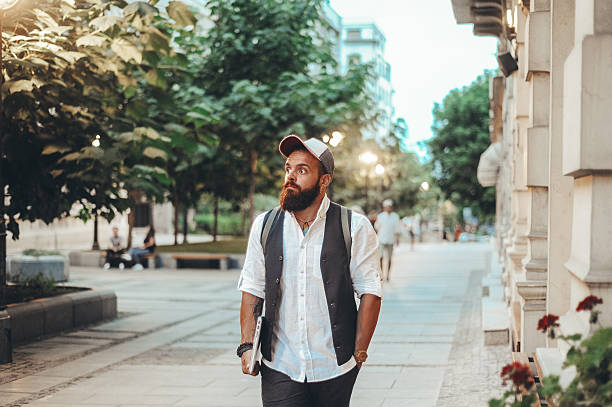istock Bearded Man Strolling in Urban Park 2208534862