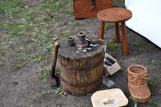 istock A close up on a log secured with massive metal straps including some handles and a machine used for minting coins standing on it seen on a sunny summer day during a medieval fair in Poland 2208536916