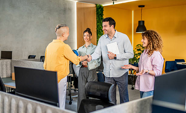 istock Young business people shaking hands 2208538678