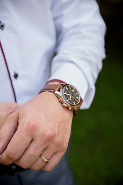 istock A man checking a wristwatch closeup 2208540129
