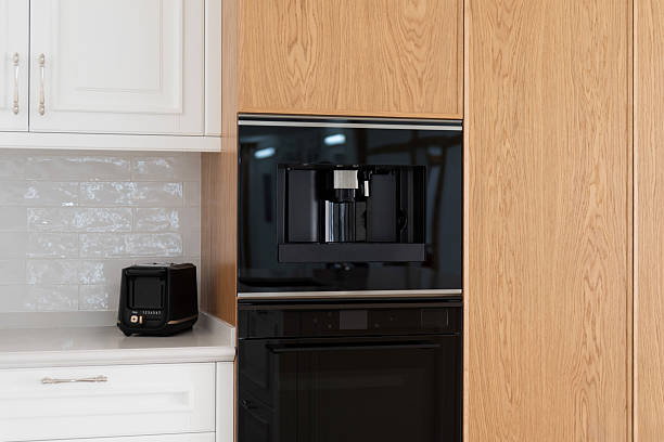 istock Built-in coffee machine integrated into wooden kitchen cabinets 2208541128