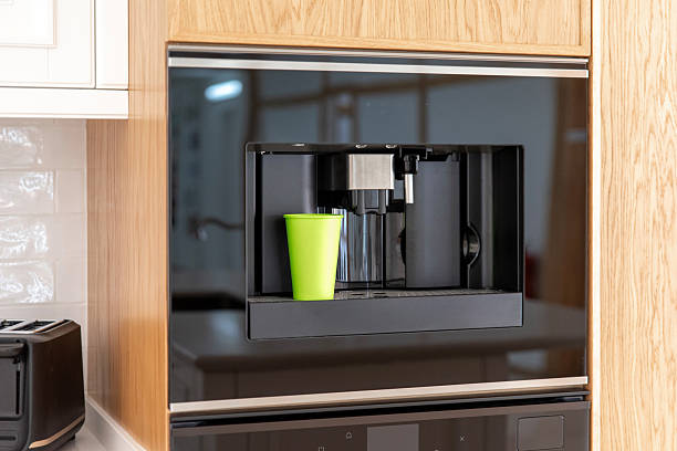 istock Built-in coffee machine with green paper cup 2208541129