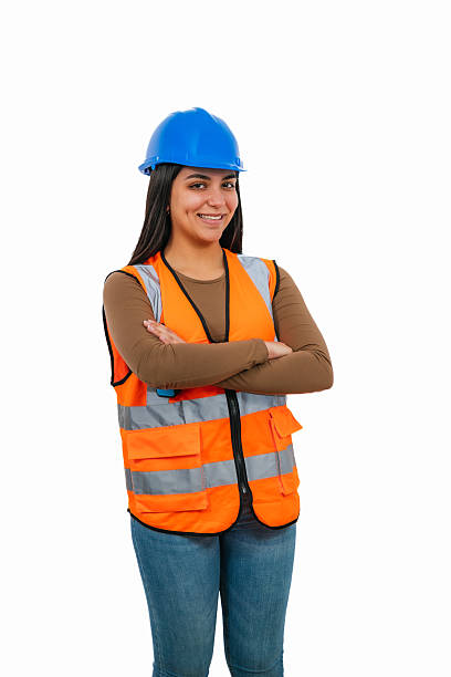 istock Young Latina construction worker smiling with arms crossed on white background 2208541732