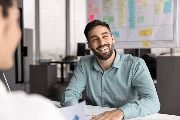 istock Positive Hispanic project manager man meeting with colleagues off screen 2208545673
