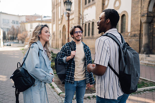 istock University students talking and walking together on campus 2208546092