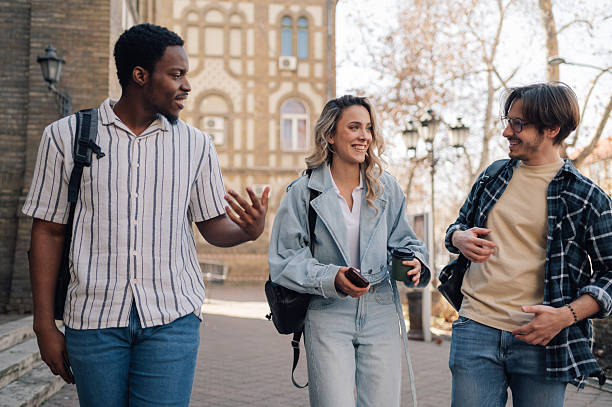 istock University students walking and talking together on campus 2208546161