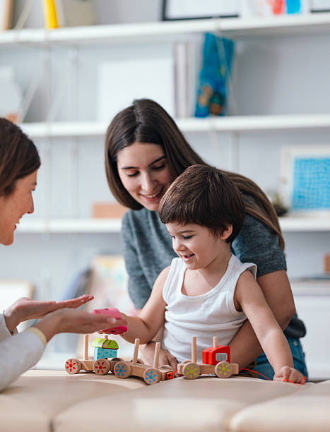 istock Young Child Enjoying Playtime With Parent During Pediatrician Visit 2208547126