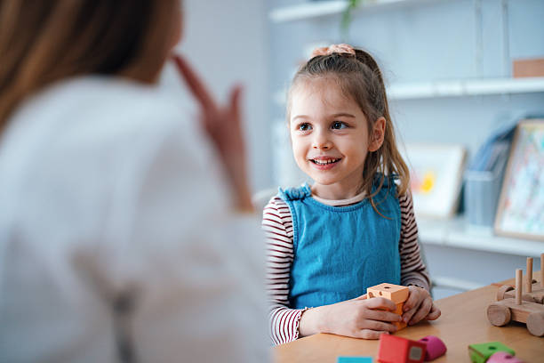 Smiling Girl Engaged in Educational Activity at a Bright Learning Environment