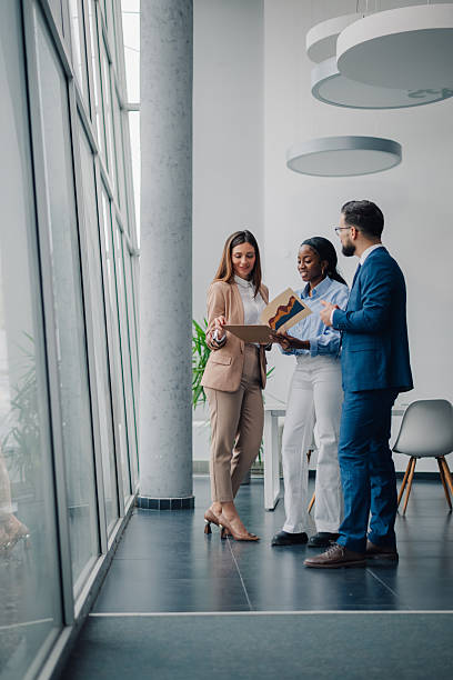 istock Business people discussing charts in modern office 2208547842