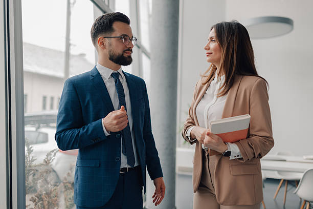 istock Business partners discussing new strategies in modern office 2208547894