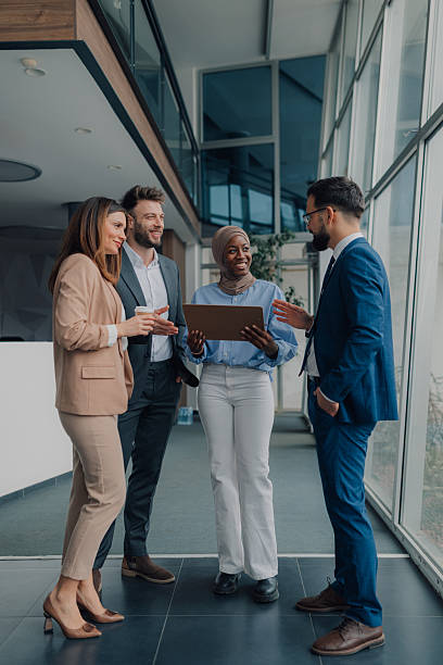 istock Business team discussing work in modern office building 2208547901