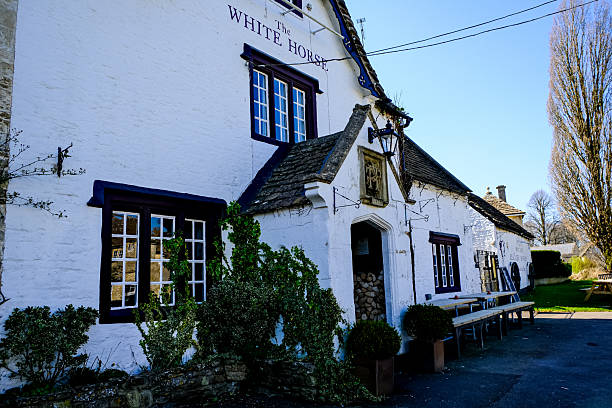 Picturesque view of lulworth village, showcasing traditional houses, lush greenery, and a serene atmosphere