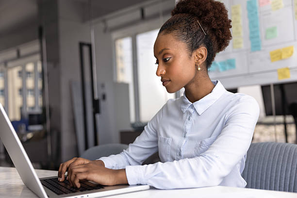 istock Serious young Black manager woman typing on laptop at workplace 2208550699