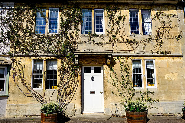 Lacock, Wiltshire, UK - 31.03.2025. The historic and well preserved village of Lacock, in county Wiltshire is popular tourist stop. The medieval village of Lacock in Wiltshire, with its timber-framed cottages and stunning abbey, has to be one of the prettiest villages in England. It's picturesque streets, historic cottages and century inns make it a firm favourite with film and TV producers. The village’s most famous appearances include Downton Abbey, the BBC’s Pride and Prejudice and Cranford, and the Harry Potter films.