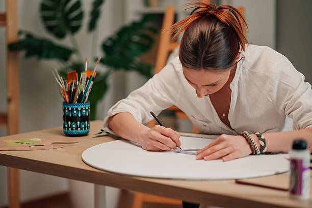 istock Female artist sketching on canvas in art studio: creativity and passion 2208552206