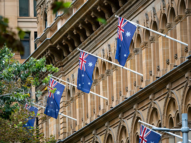 Australian flags in front of a building in Sydney Central Business District