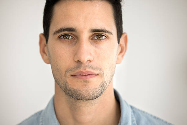 istock Serious Latin man looking at camera posing for facial shot 2208554259