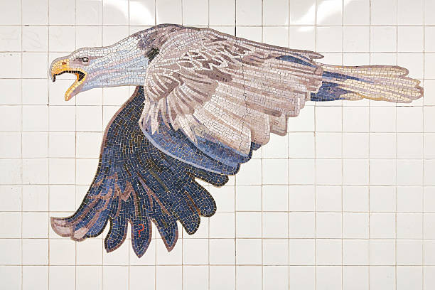 Bald Eagle mosaic inside 81St-Museum of Natural History station, on the subway platform wall, in New York City, USA in the evening.