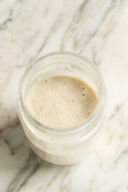 istock glass jar of sourdough starter 2208559446