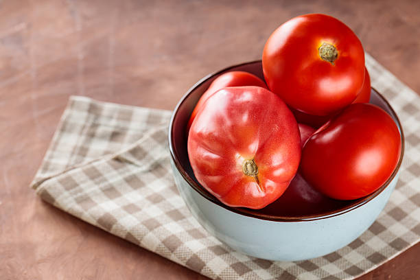 Fresh Red Tomatoes in Bowl on Checkered Napkin, Copy Space