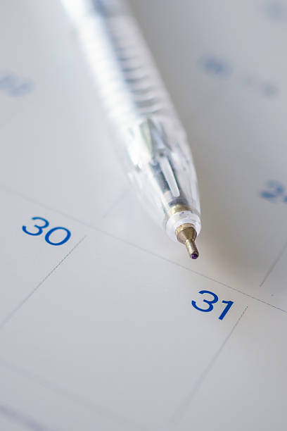 istock pen on calendar page background business planning appointment meeting concept 2208561933