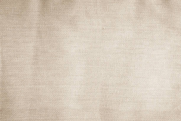 istock Brown sackcloth woven texture background in natural pattern. Jute hessian burlap, linen background in light beige cream color blank. Weaving canvas fiber line cotton cloth textured as organic. 2208562075