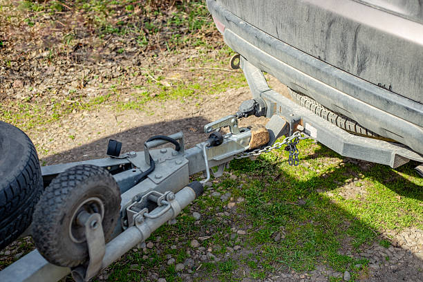 istock passenger car coupled to a trailer. Metal structure for towing 2208562089
