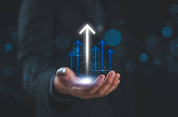 istock Hand holding growth business strategy arrow concept on success target improvement with increase development graph profit or economy investment income target and goal increase achievement. 2208572748