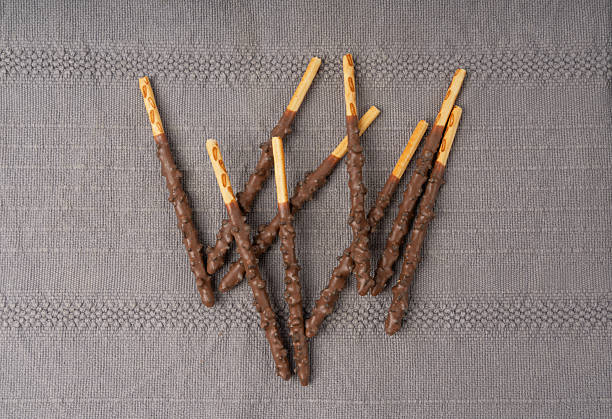 Chocolate cookie sticks, long choco pastries confectionery, japan biscuit tubes, sweet cocoa cream covered grissini, korea cracker sticks confectionery