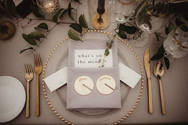 istock Elegant place setting at head table for bride and groom at wedding reception 2208578356