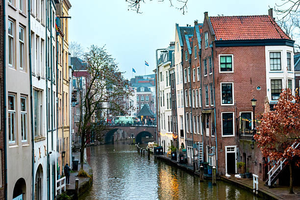istock A canal with a bridge and a few buildings 2208579633