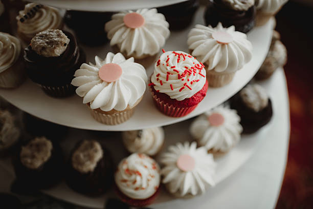 istock Cupcakes on dessert stand with frosting and sprinkles 2208579939