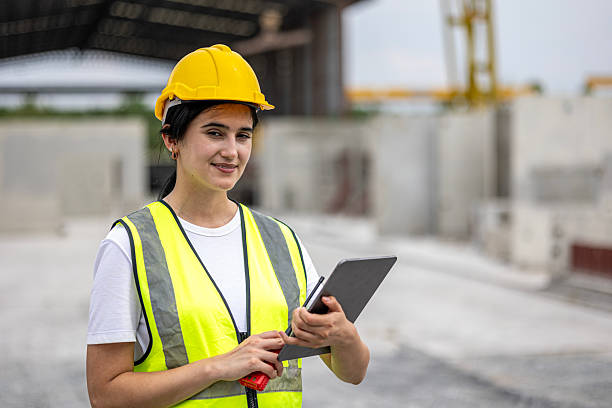 istock Attractive female civil engineer in a factory 2208582157