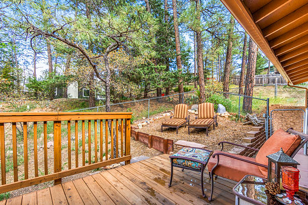 istock On the wooden deck, there are chairs and a table placed on it 2208585256
