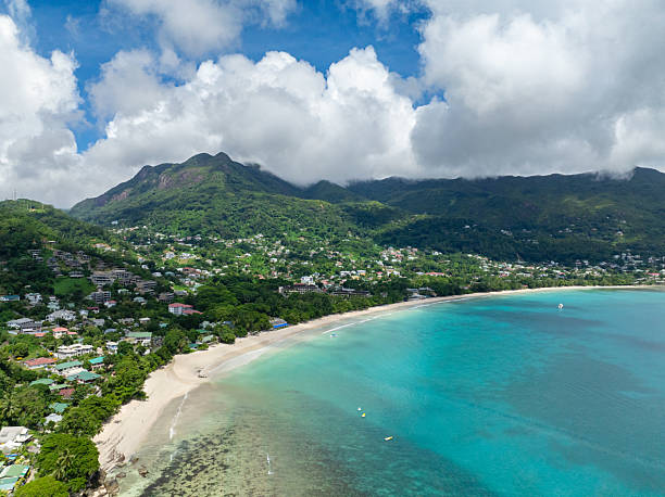 istock Curved sandy beach with mountainous surroundings and clear waters. Seychelles, Mahe. 2208586079