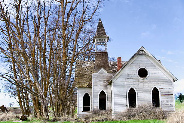 istock Abandoned Wooden Church with Gothic Windows 2208590811