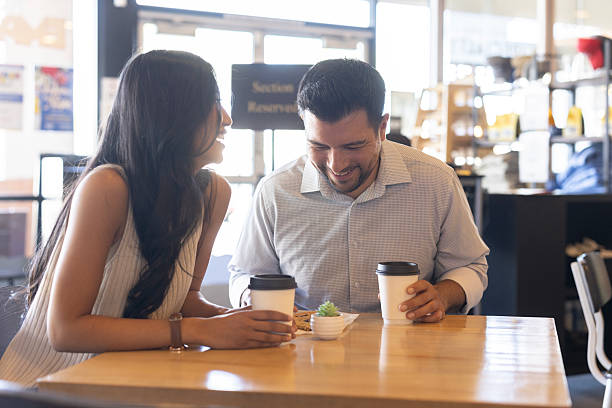 istock Couple at coffee shop 2208593310