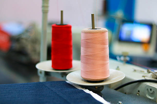 spools of thread on a sewing machine, closeup of photo