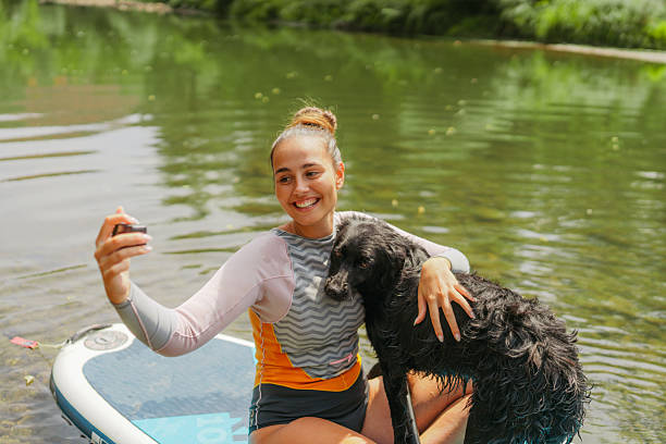 istock Selfie on the river with my dog 2208600581
