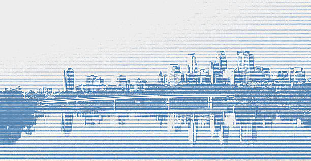 Minneapolis, Minnesota skyline with Mississippi River and bridge in foreground