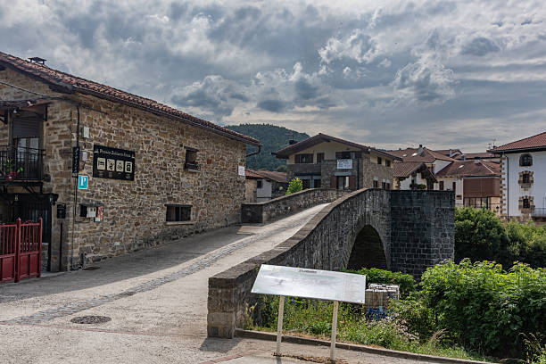 This bridge, Puente de La Rabia, is the entrance to Zubiri. It was built with stone and has a beautiful arch. A map of Zubiri stands in front of this bridge.
