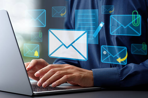 istock Businessman writing email on laptop computer. Sending reply mails with attachment file. Hands typing on keyboard. Man working at desk in office. 2208603075