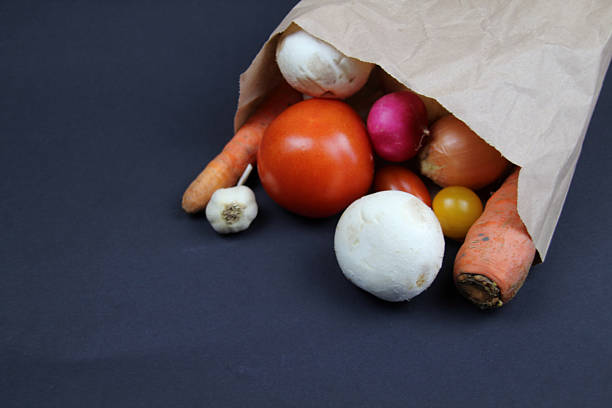 Variation of fresh vegetables on white wooden kitchen table