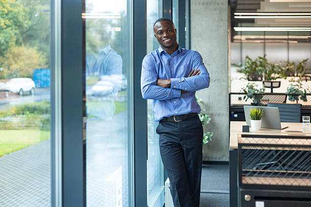 istock Young handsome african businessman smiling in an office environment 2208614093