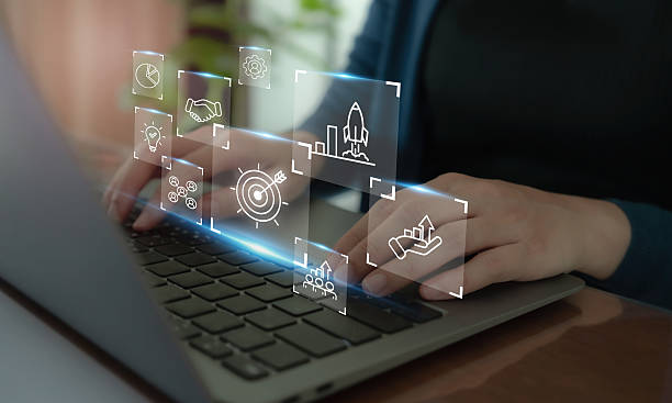 istock Business strategy concept. Using laptop with the icon representing business strategy elements; teamwork, partnership, innovation and technology, target and growth. Business goal acheivement. 2208615539
