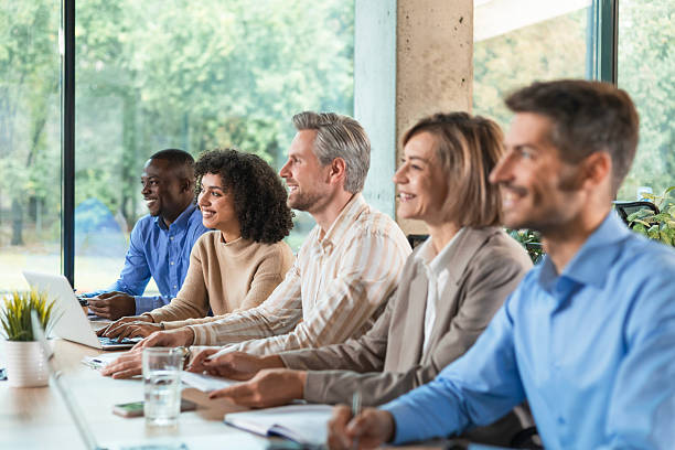 istock Row of business people working at seminar 2208616830